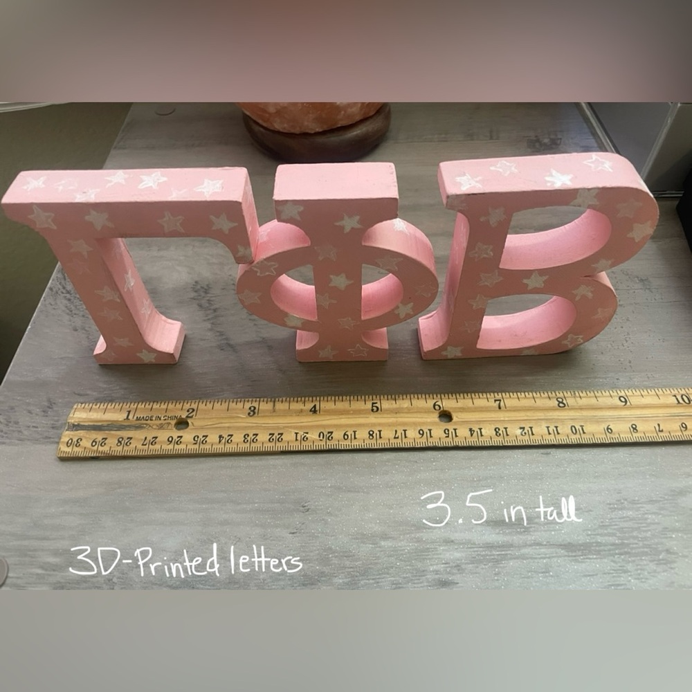 3D printed Gphi letters.